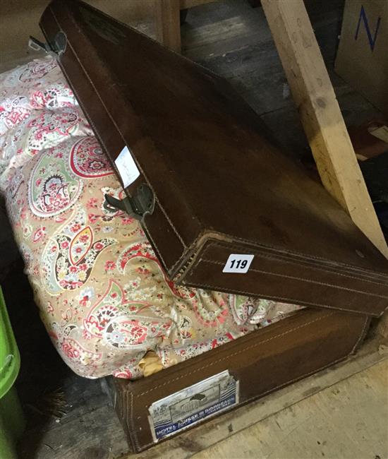 Brown leather suitcase & paisley eiderdown